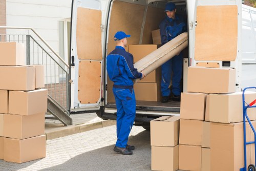 Local removal team planning a move in Hounslow with boxes and furniture
