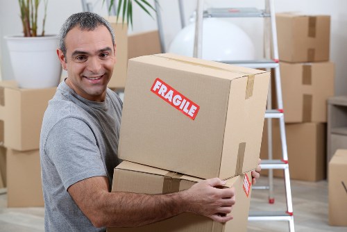 Moving van service with boxed items ready for collection