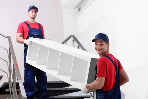 Movers working around access and parking at a Hounslow flat