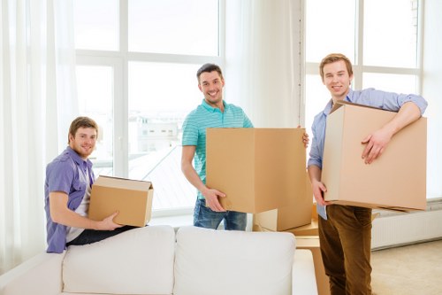 Removal van loading furniture and boxes for a move in Hounslow