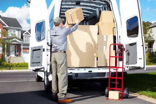 Business relocation team unloading office furniture in Hounslow