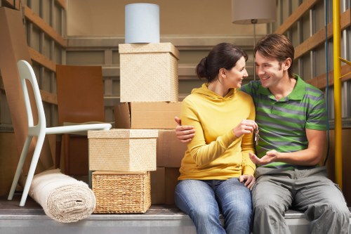 Unpacking service arranging household items into the right rooms after a Hounslow move
